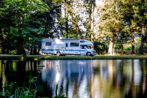 Family trip in motorhome in forest or park in South Chile