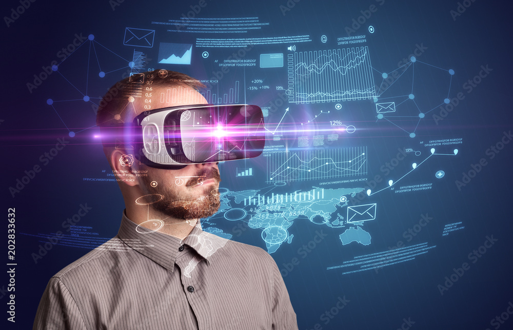 Amazed businessman with virtual reality business plan in front of him Amazed businessman with virtual reality business plan in front of him