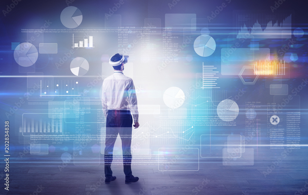 Good looking businessman checking reports and charts with vr glasses
Good looking businessman checking reports and charts with vr glasses