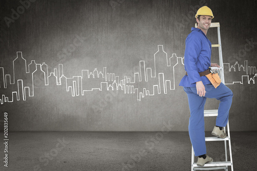 Portrait of repairman climbing step ladder against hand drawn city plan