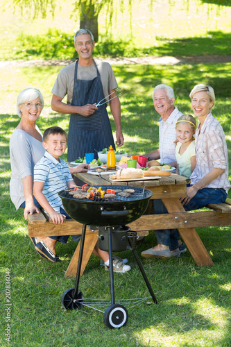 Happy family having picnic in the park 