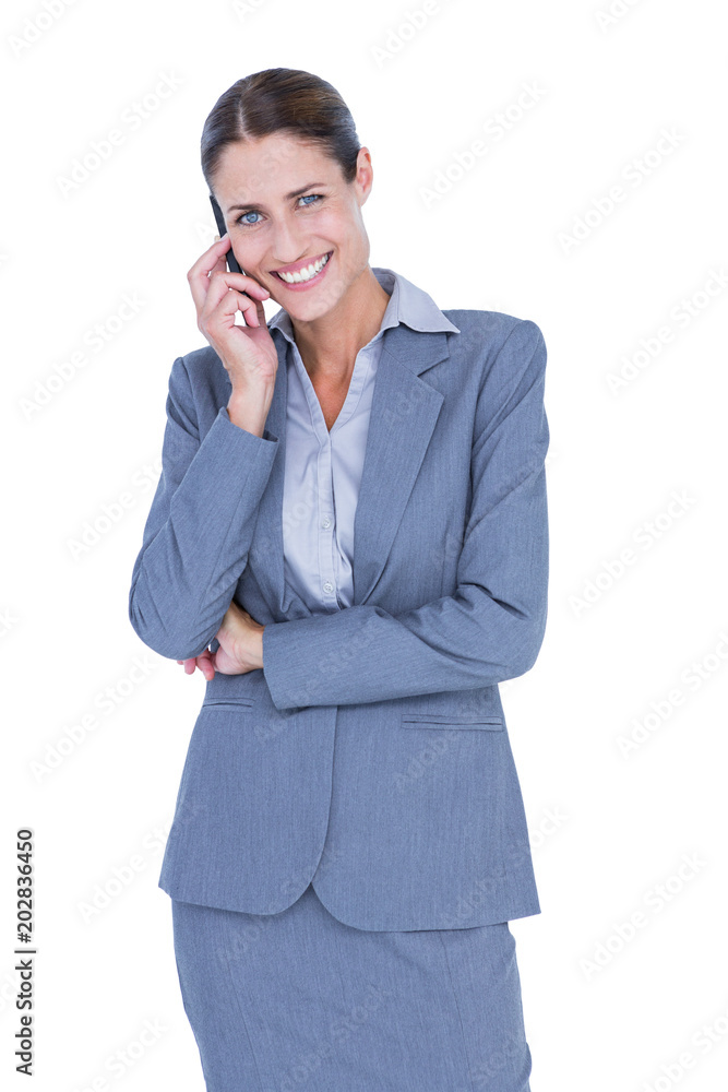 Businesswoman calling with her smartphone Businesswoman calling with her smartphone