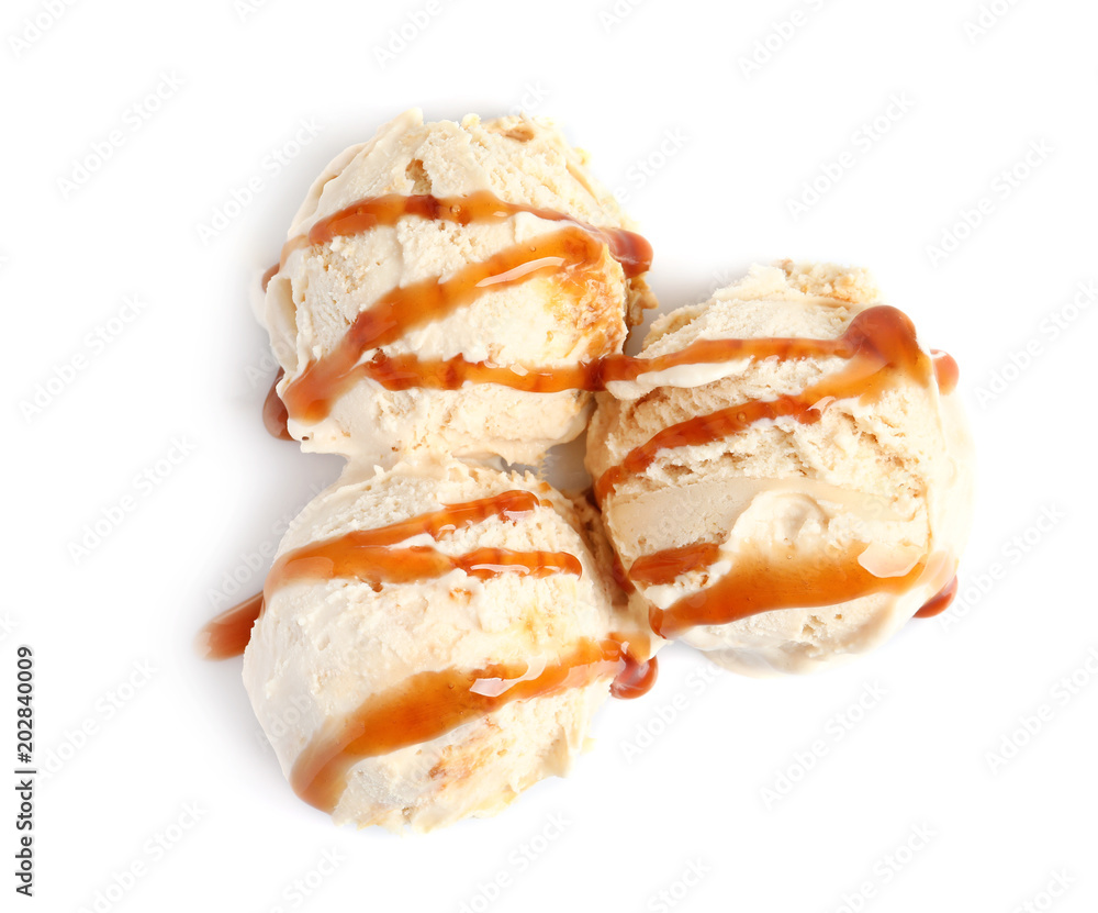 Tasty ice cream with caramel sauce on white background Tasty ice cream with caramel sauce on white background
