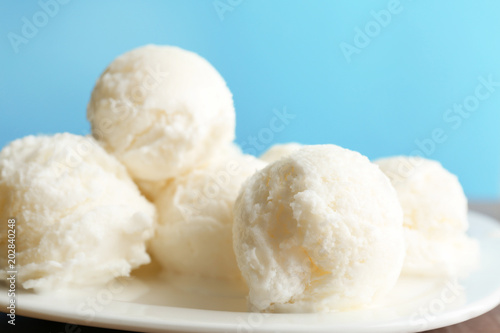 Fototapeta Naklejka Na Ścianę i Meble -  Plate with tasty vanilla ice cream, closeup