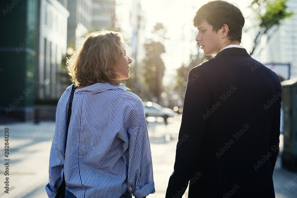 Couple walking on downtown together
