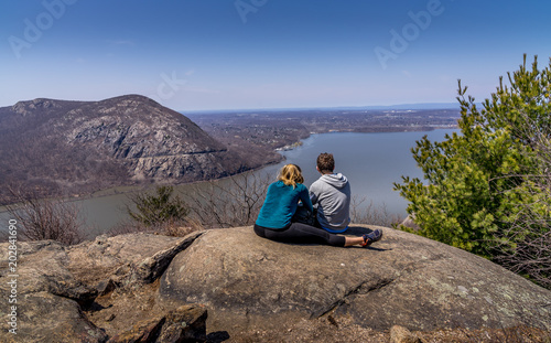 Young couple overlooking Hudson River at Bull Hill near Cold Spring, NY photo