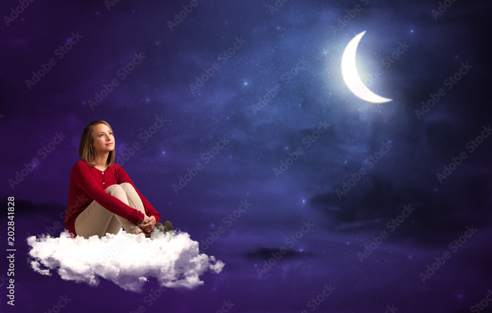 Caucasian woman sitting and wondering on a white cloud, under the moonshine