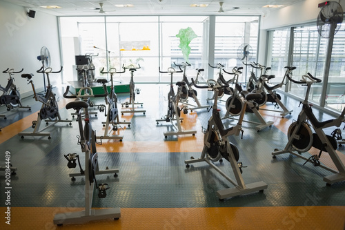 Large empty fitness studio with spin bikes