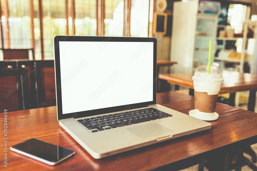 Laptop computer white screen on wood table Laptop computer white screen on wood table