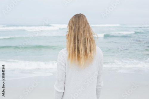 Rear view of a casual blond at beach
