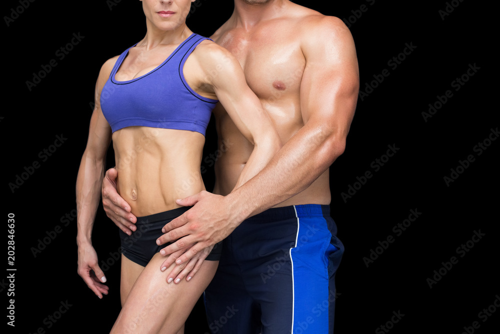 Naklejka premium Fit bodybuilding couple posing together 