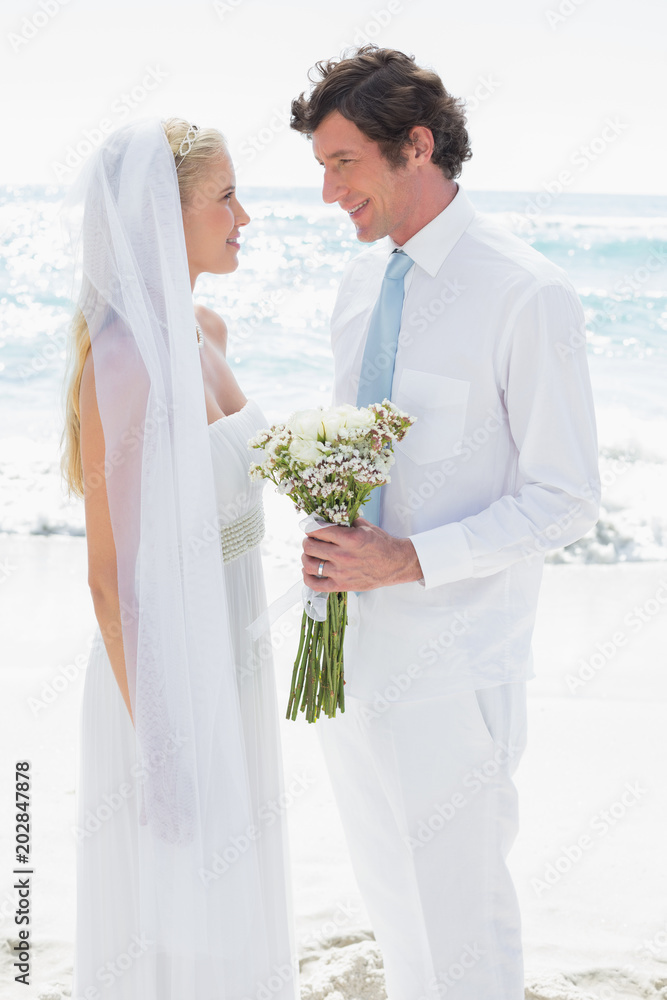 Fototapeta premium Bride and groom smiling at each other