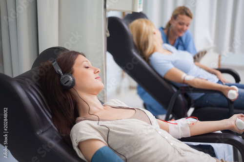 Patient listening music while being transfused