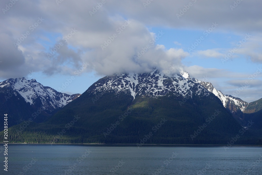Alaskan snow-capped mountains view from the water Alaskan snow-capped mountains view from the water