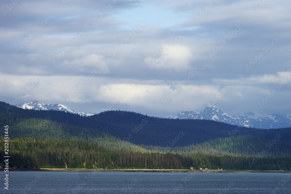 Alaskan snow-capped mountains view from the water Alaskan snow-capped mountains view from the water