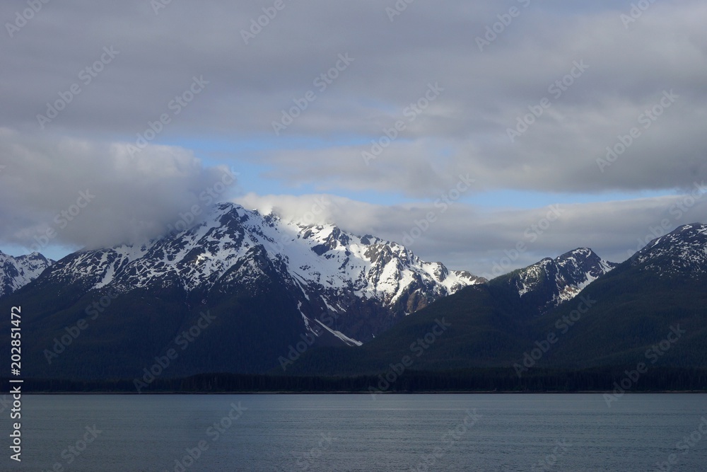 Alaskan snow-capped mountains view from the water Alaskan snow-capped mountains view from the water