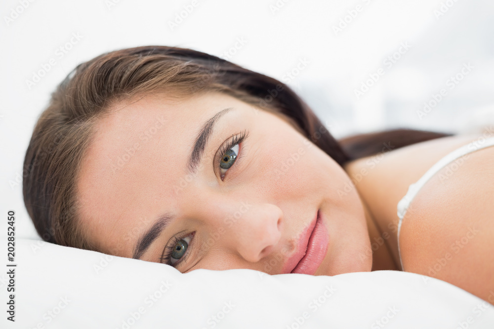 Close up of a pretty woman resting in bed Close up of a pretty woman resting in bed