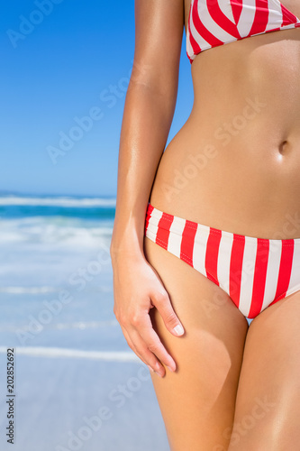 Fit woman in bikini on the beach