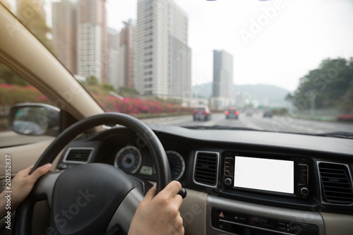  driving car on city street use gps navigation
