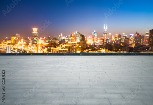 empty brick floor with dreamlike cityscape