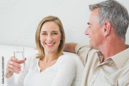 Relaxed couple with a glass of water