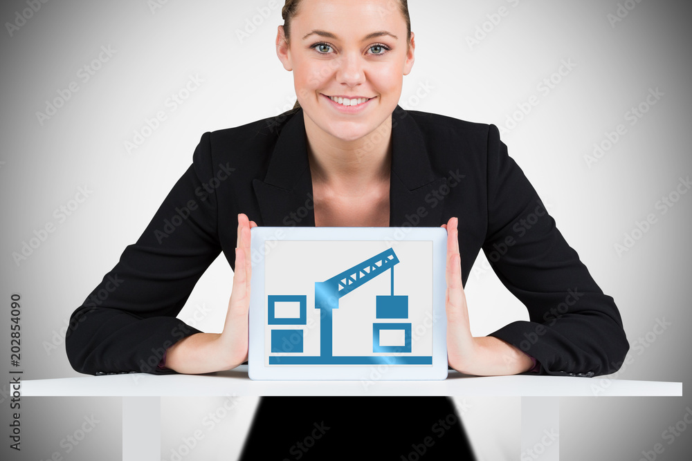 Businesswoman showing tablet pc against white background with vignette Businesswoman showing tablet pc against white background with vignette