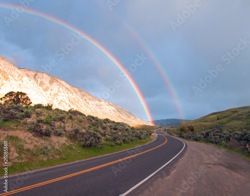 Double Rainbow over road to Mammoth Hot Springs in Yellowstone National Park in Wyoming USA