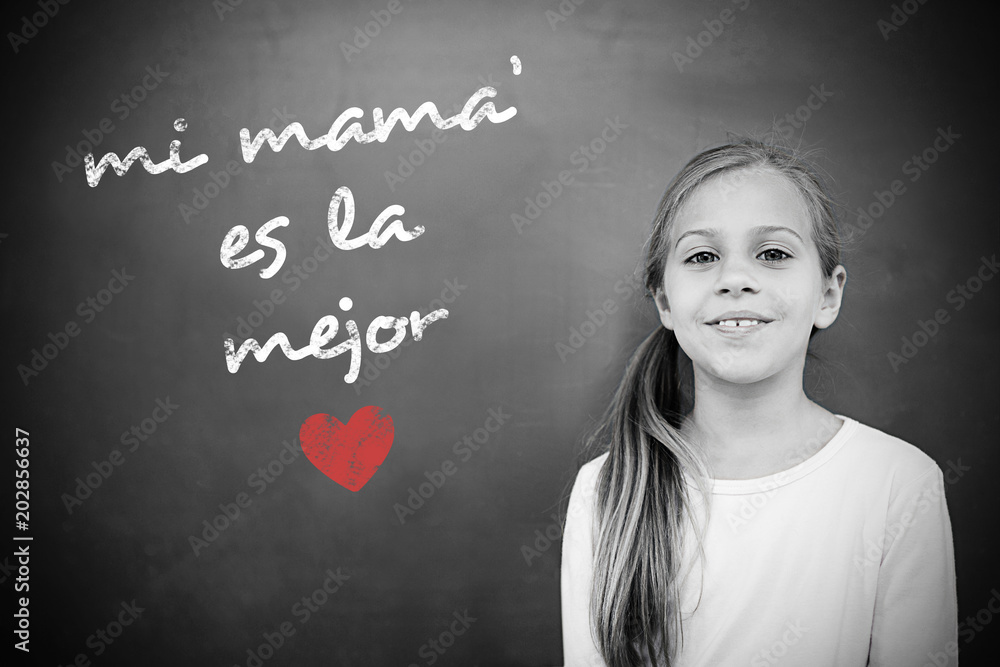 Schoolchild with blackboard against spanish mothers day message