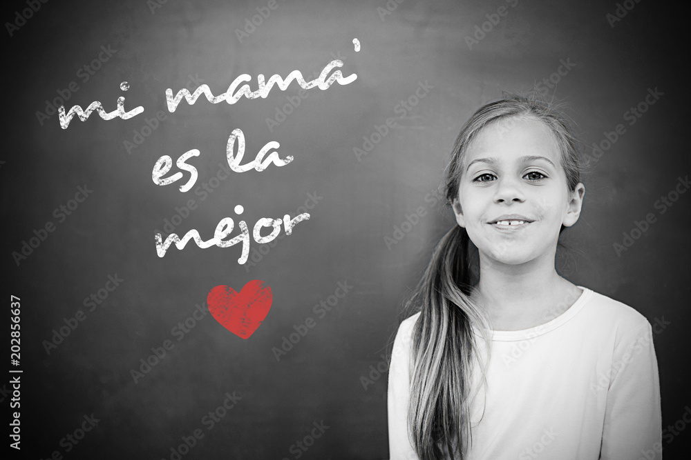 Schoolchild with blackboard against spanish mothers day message Schoolchild with blackboard against spanish mothers day message