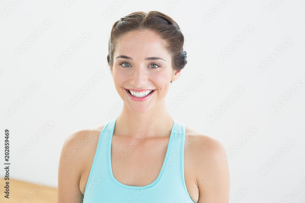 Smiling young woman in blue sports bra Smiling young woman in blue sports bra