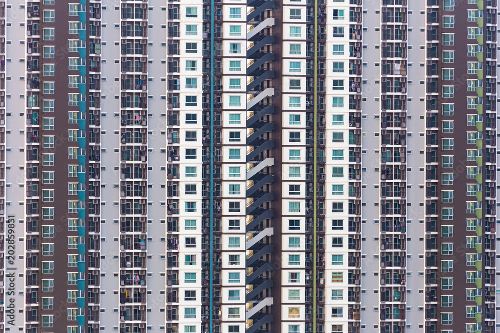 Vertical scene of crowded small rooms and exterior of high condominium building for sell and rental inside urban city. Vertical scene of crowded small rooms and exterior of high condominium building for sell and rental inside urban city.