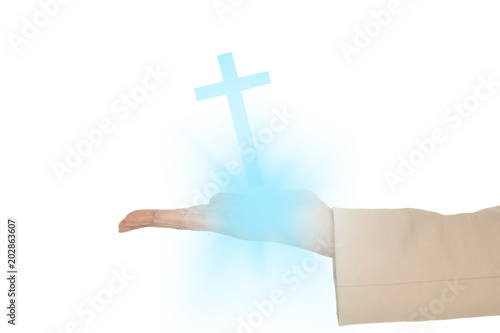 Female hand presenting against white cross