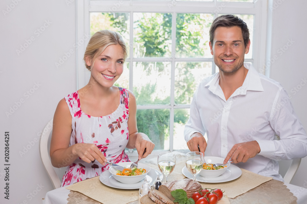 Portrait of a happy couple having food