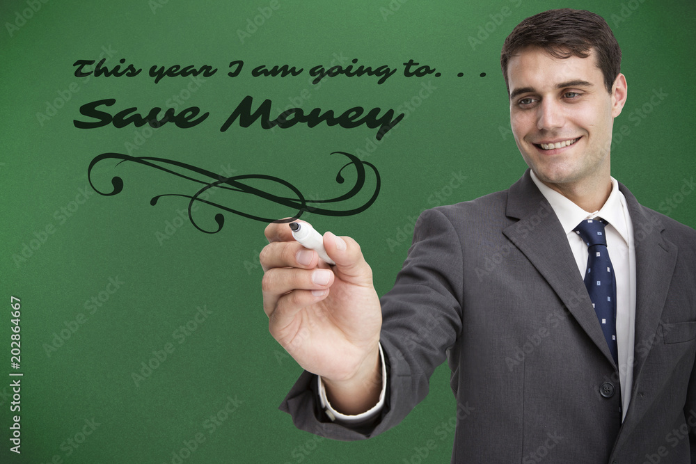 Young businessman writing something against green background with vignette