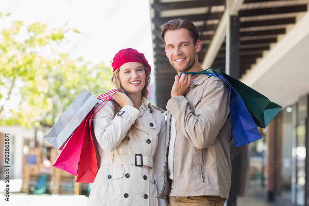 Fototapeta premium A happy couple with shopping bags 