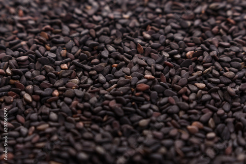 fresh sesame seeds on a rustic background