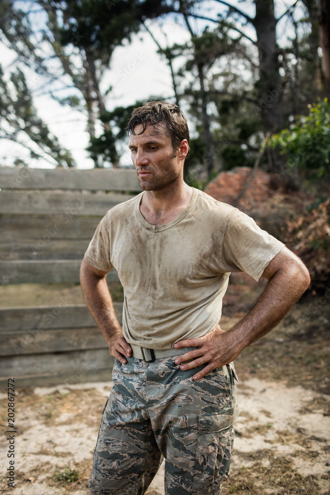 Soldier sitting on his knees with hands on his hip Soldier sitting on his knees with hands on his hip