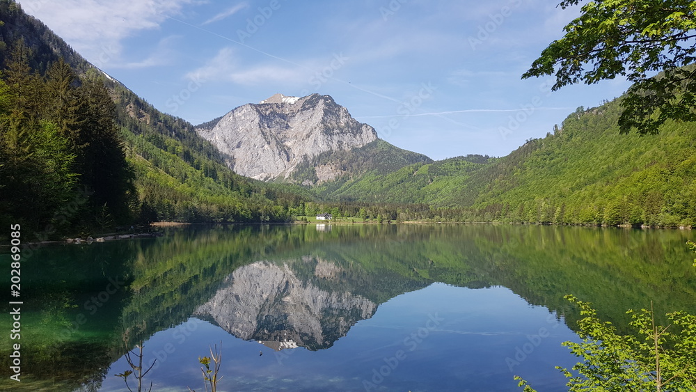 mountain reflecting in calm lake
