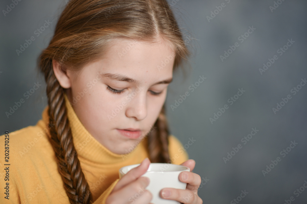 sick girl holding cup of tea sick girl holding cup of tea