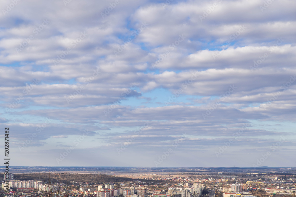 Fototapeta premium cityscape view. cloudy day. city horizon line with clouds. copy space.