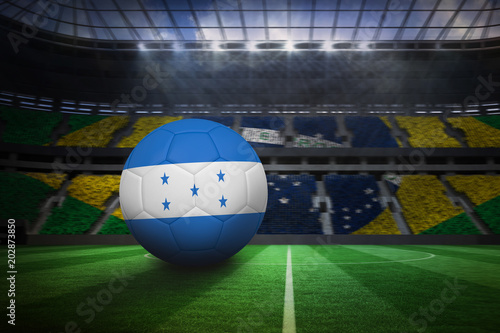 Football in honduras colours in large football stadium with brasilian fans