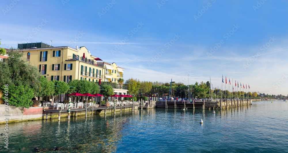Landscape with Garda lake and Hotels on beach, Sirmione, Italy.