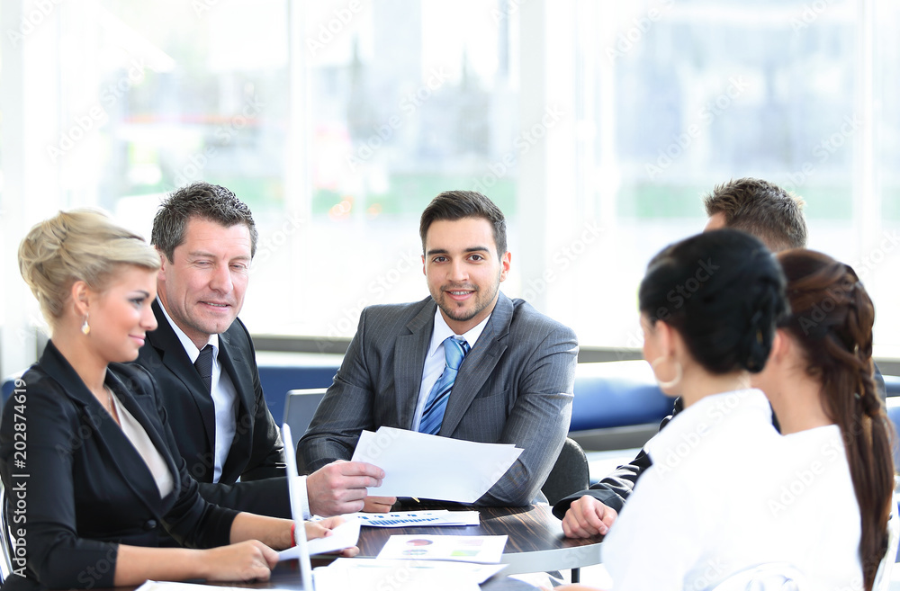 business partners and business team discussing business issues in office business partners and business team discussing business issues in office