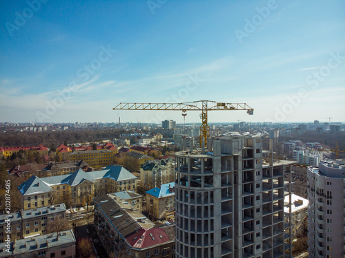 birds eye view on contraction site with crane