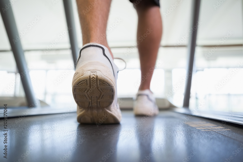 Naklejka premium Man walking on the treadmill