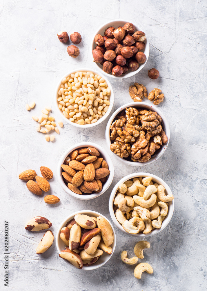 Nuts assortments on stone table top view. Nuts assortments on stone table top view.