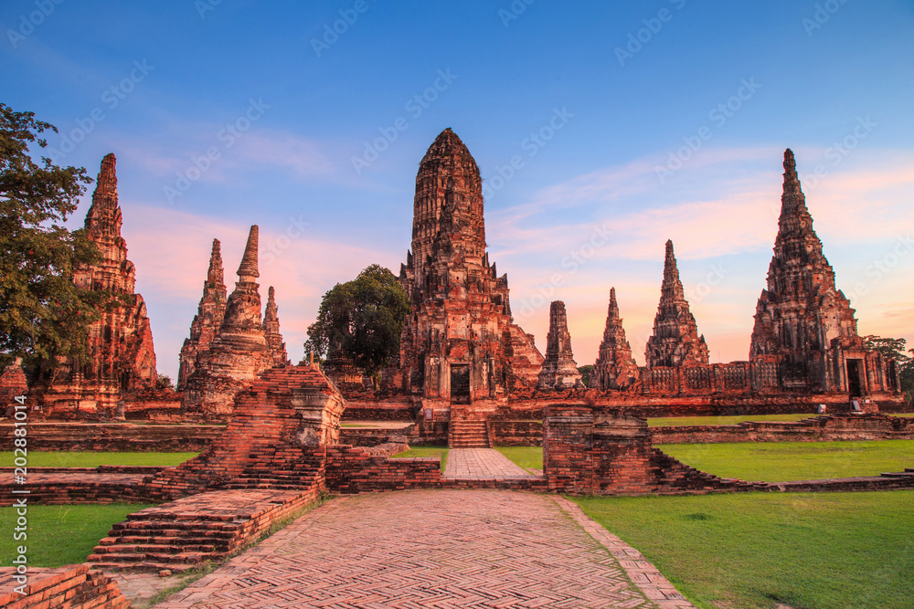 An ancient ruin of Wat Chaiwatthanaram with blue sky. An ancient ruin of Wat Chaiwatthanaram with blue sky.