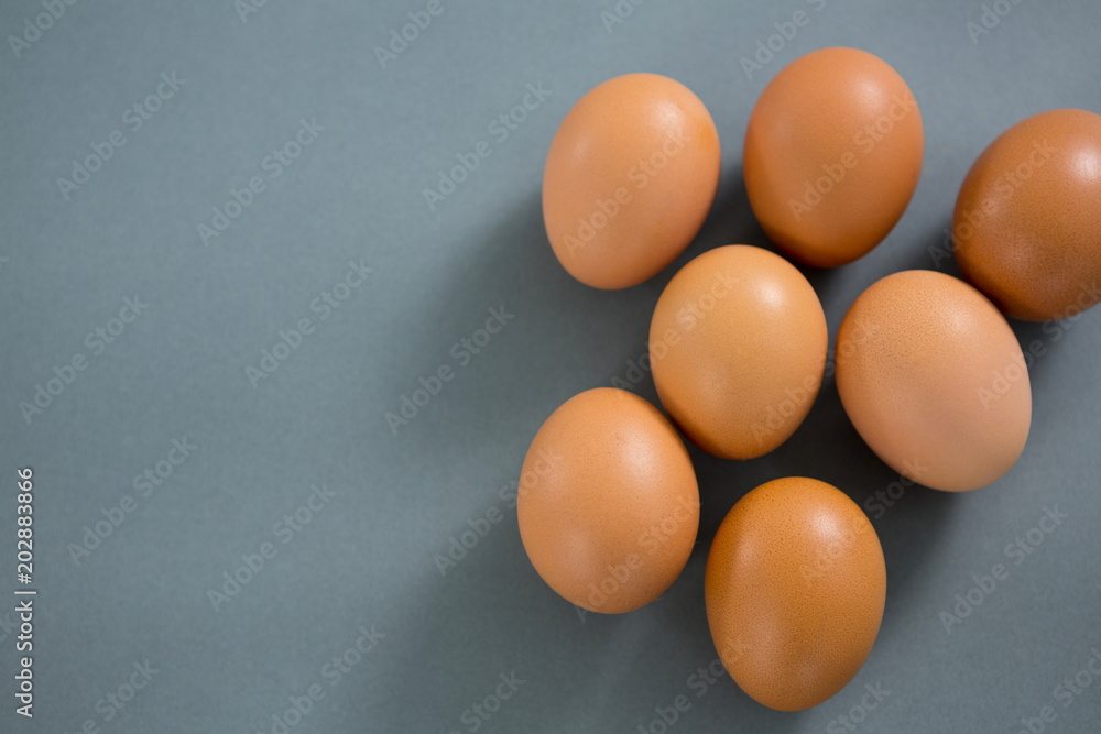 Brown eggs on grey background Brown eggs on grey background