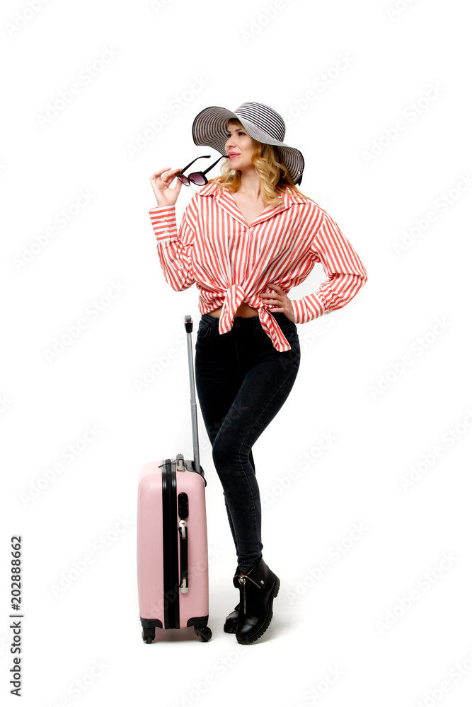 Photo of woman in hat with tourist suitcase Photo of woman in hat with tourist suitcase