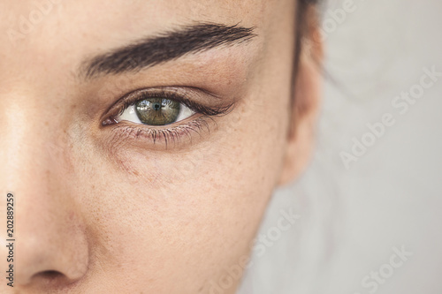 Fototapeta Naklejka Na Ścianę i Meble -  Brown eye of young woman